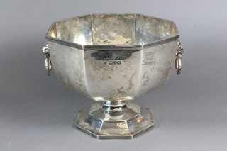 An octagonal silver rose bowl with lion mask handles, raised on  a spreading foot, Sheffield 1912, 20 ozs   ILLUSTRATED