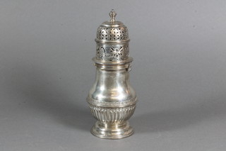 An Edwardian silver sugar sifter of baluster form with  demi-reeded decoration, Chester 1903, 7 ozs