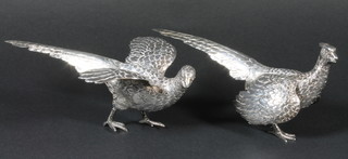 A pair of French silver table ornaments in the form of pheasants London import mark 1978, by Israel Freeman & Son Ltd.  London, 11 ozs  ILLUSTRATED