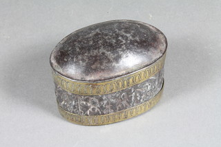 An oval Indian embossed metal and brass banded double lidded  spice box 2.5"