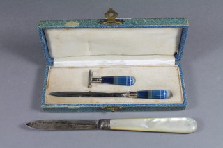 A Victorian silver bladed folding fruit knife with mother of pearl  grip, London 1867 and an Art Deco polished blue stone and steel  desk set