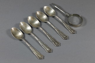 5 silver coffee spoons, London 1927 and a magnifying glass with silver plated handle 3 ozs