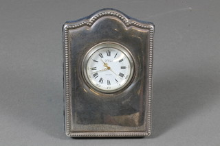 R Carr, a modern timepiece contained in a silver easel frame 3" x 2.5"