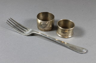 A silver Old English pattern George III silver table fork London 1806 and 2 silver napkin rings 3 ozs
