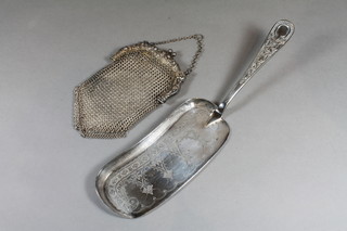 A silver plated chain mail evening bag together with a silver plated crumb scoop