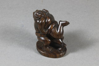 A 20th Century carved fruitwood Netsuke of 2 wrestlers 2"