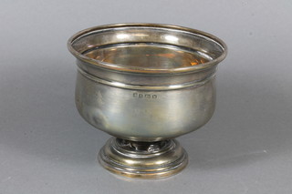 A circular silver bowl raised on a spreading foot, Birmingham  1921, 4 ozs