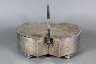 A Victorian shaped and engraved silver plated biscuit box, raised  on pierced acorn supports