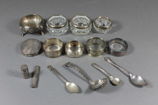 A silver salt, 2 silver napkin rings, a silver condiment spoon,  silver coffee spoon and teaspoon, silver compact with engine  turned decoration 2", 3 ozs and 2 circular cut glass salts with  silver rims etc