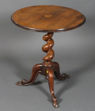 A Victorian circular rosewood wine table raised on a spiral turned and tripod base 22"