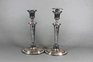 A pair of Adam style silver plated candlesticks of oval form 10"