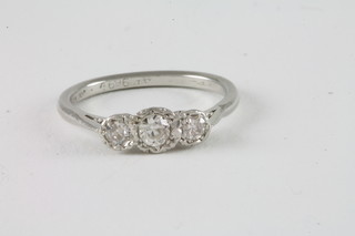A platinum dress ring set 3 diamonds