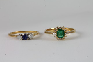 An 18ct gold dress ring set an emerald and an 18ct gold dress  ring set sapphires and 2 diamonds