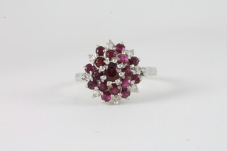 An 18ct white gold ruby and diamond cluster ring