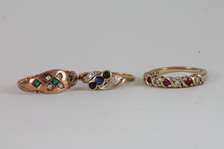 A 9ct gold dress ring set rubies and diamonds, a 9ct gold dress  ring set sapphires and diamonds and a 9ct gold dress ring set  emeralds and diamonds