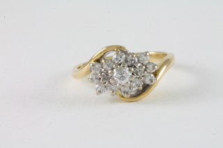 An 18ct yellow gold cross-over cluster dress ring