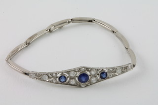 An Edwardian white gold bracelet set sapphires and diamonds