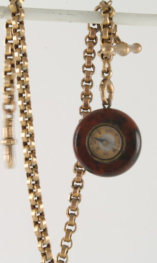 A yellow metal belcher link chain hung a hardstone seal in the form of a compass