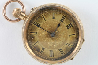 A lady's fob watch contained in a 14ct chased gold case