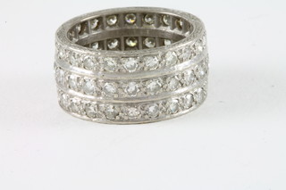 A lady's 18ct white gold ring, formed of 3 rows set diamonds,  approx 3ct
