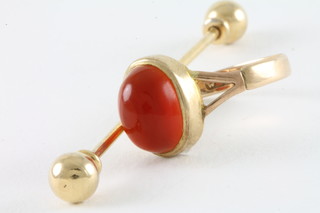 A 9ct gold dress ring set an orange cabouchon cut stone together  with a tie pin