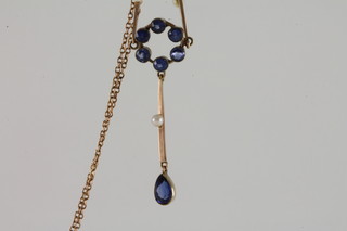 An Edwardian 9ct gold pendant set pearls and blue stones
