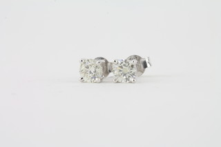 A pair of 18ct gold earrings set diamonds approx 1.03ct