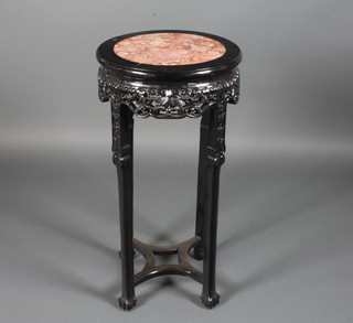 An Oriental pierced ebonised circular hardwood jardiniere stand  with pink veined marble top, 32"h x 16"diam.