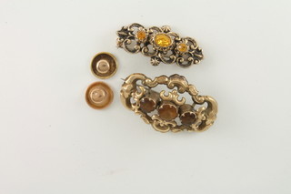 A pinch beck brooch and 1 other