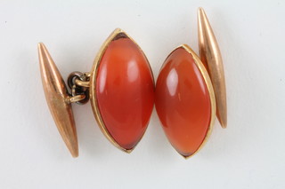 A pair of hardstone and yellow metal cufflinks