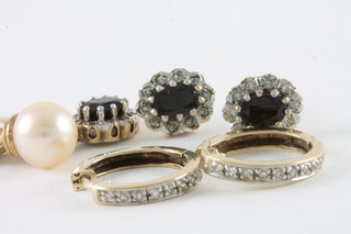 A pair of 9ct gold hoop earrings, a pair of sapphire and diamond cluster earrings, a 9ct gold diamond set pendant and a 9ct gold  pendant