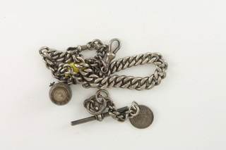 A silver curb link watch chain 1 ozs, a silver T bar together with  a hardstone seal in the form of a barrel