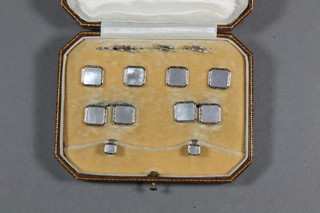 A pair of 9ct gold white metal and mother of pearl set evening  dress cufflinks together with 4 square buttons and a pair of dress  studs, cased