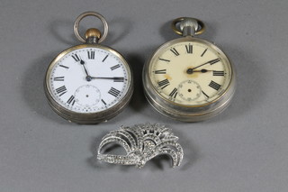 An open faced keyless pocket watch contained in a silver case, 1 other open faced pocket watch and a marcasite brooch