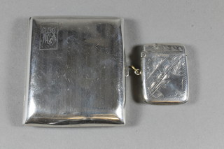 An Edwardian silver vesta case Chester 1904 and a silver  cigarette case Birmingham 1924, 2 ozs