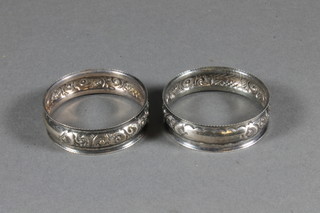 A pair of Edwardian embossed silver napkin rings Birmingham  1906