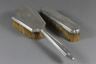 A  silver backed hair brush and matching clothes brush, with engine turned decoration London 1929 and 1930