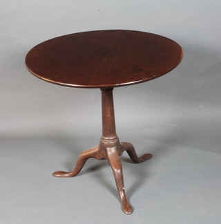 A George III mahogany tilt top tea table, the circular top with  bird cage support, raised on a tapered column, tripod base with  slipper feet 27"h x 28"diam.