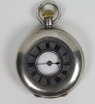 A Continental open faced demi-hunter fob watch contained in a  silver case