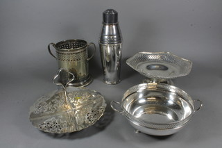An Art Deco silver plated cocktail shaker, pierced silver plated soda siphon holder, 2 pierced plated dishes and a 4 section  sandwich dish