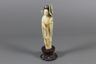 A Chinese carved ivory figure of a standing lady 5"