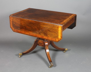 A Regency rosewood pedestal Pembroke table with cross banded  top, fitted a frieze drawer and raised on 4 bobbin turned  columns, splayed supports ending in brass caps and casters 29"h  x 36"w x 20"d  ILLUSTRATED