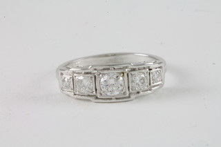 An 18ct white gold dress ring set 5 diamonds approx 0.55ct