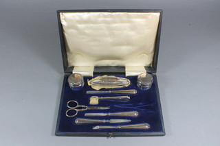 A 9 piece silver manicure set Birmingham 1920 and 1921, cased