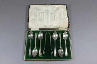 A set of 6 Edwardian silver coffee spoons Sheffield 1903 with matching tongs, 3 ozs, cased