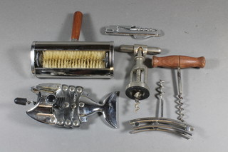 5 various corkscrews and a table brush