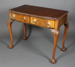 A Queen Anne style walnut bow front side table fitted 2 drawers, raised on cabriole ball and claw supports 30"h x 36"w x 20"d
