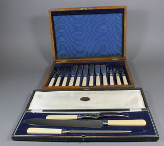 A 3 piece carving set and a canteen of 6 silver plated fish knives  and forks