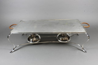 An oval silver plated 2 burner plate warmer on cabriole supports  18"