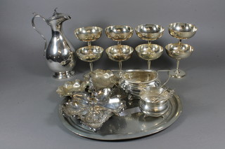 A silver plated hotwater jug, an oval pewter dish, various silver plated goblets